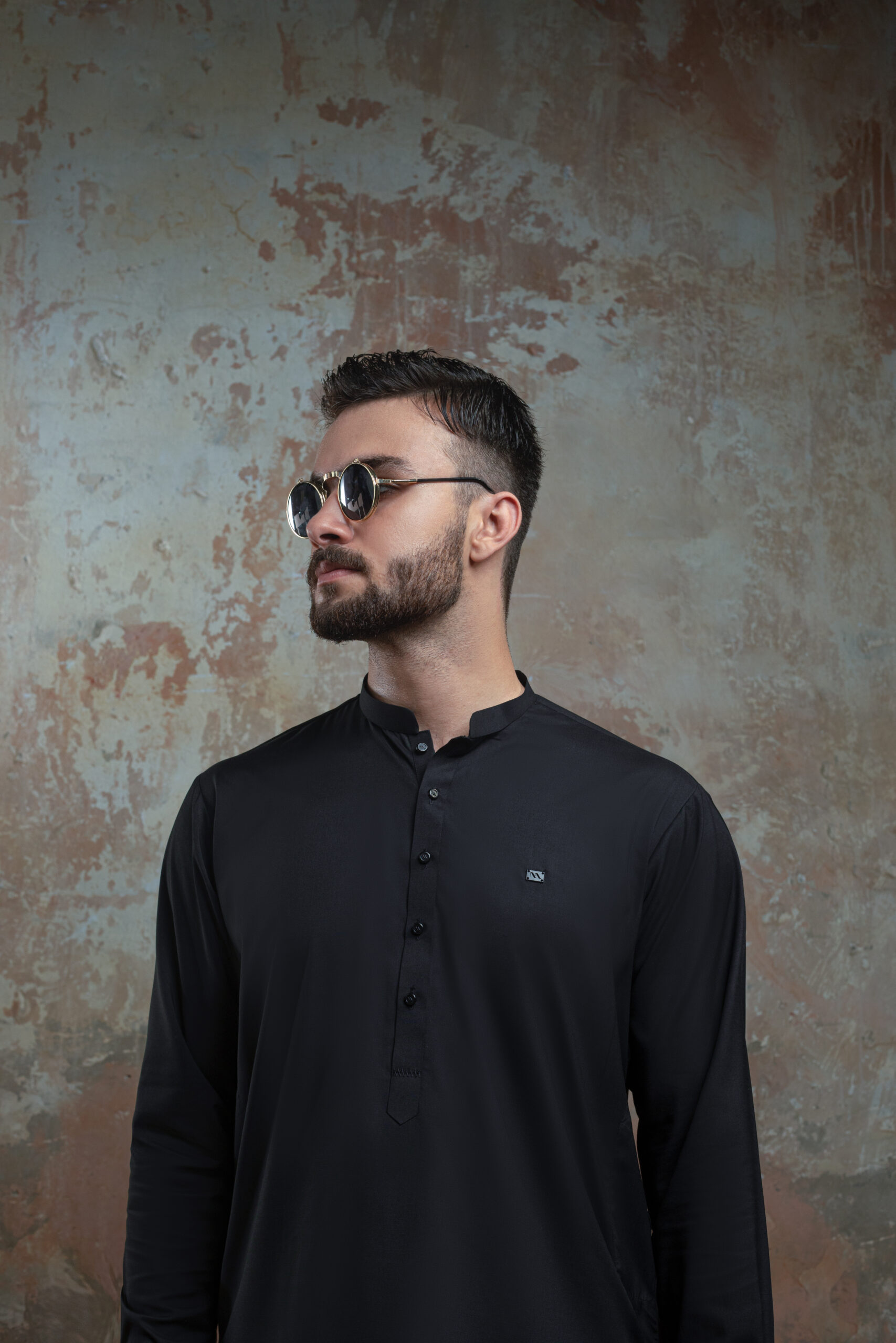 _F1A2968 Close-up of Premium Black Kurta cuff and fabric detail. Showing texture of Band Collar Kurta and refined cuff of Luxury Black Shalwar Kameez by Naushemian.