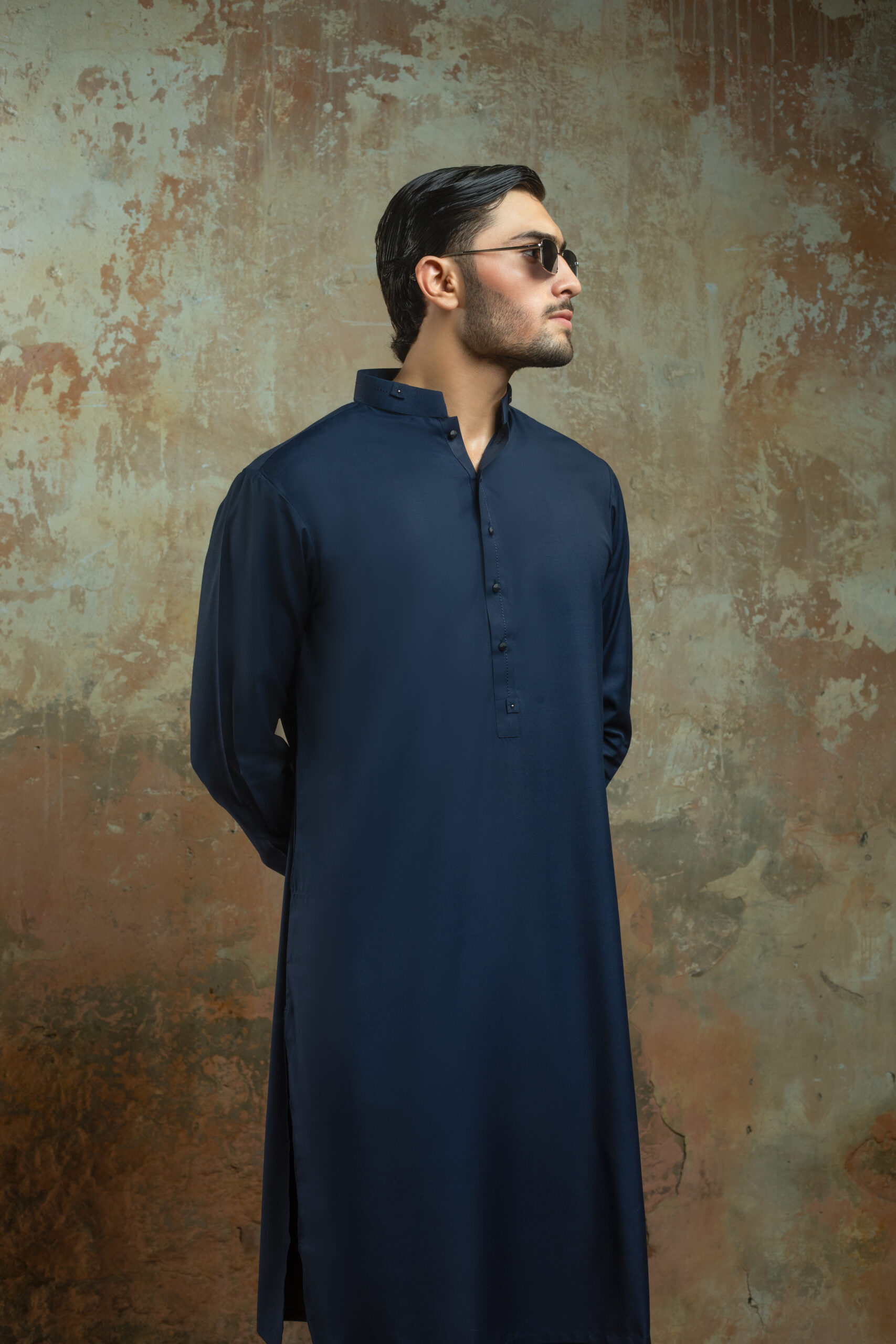 _F1A2970 Blue Mens Kurta NAVY BLUE MENS KURTA PYJAMA SET by Naushemian by Nauman Arfeen. Model wearing Mens Designer Traditional Wear with Band Collar Kurta for Formal Wedding Attire and Eid Outfit.