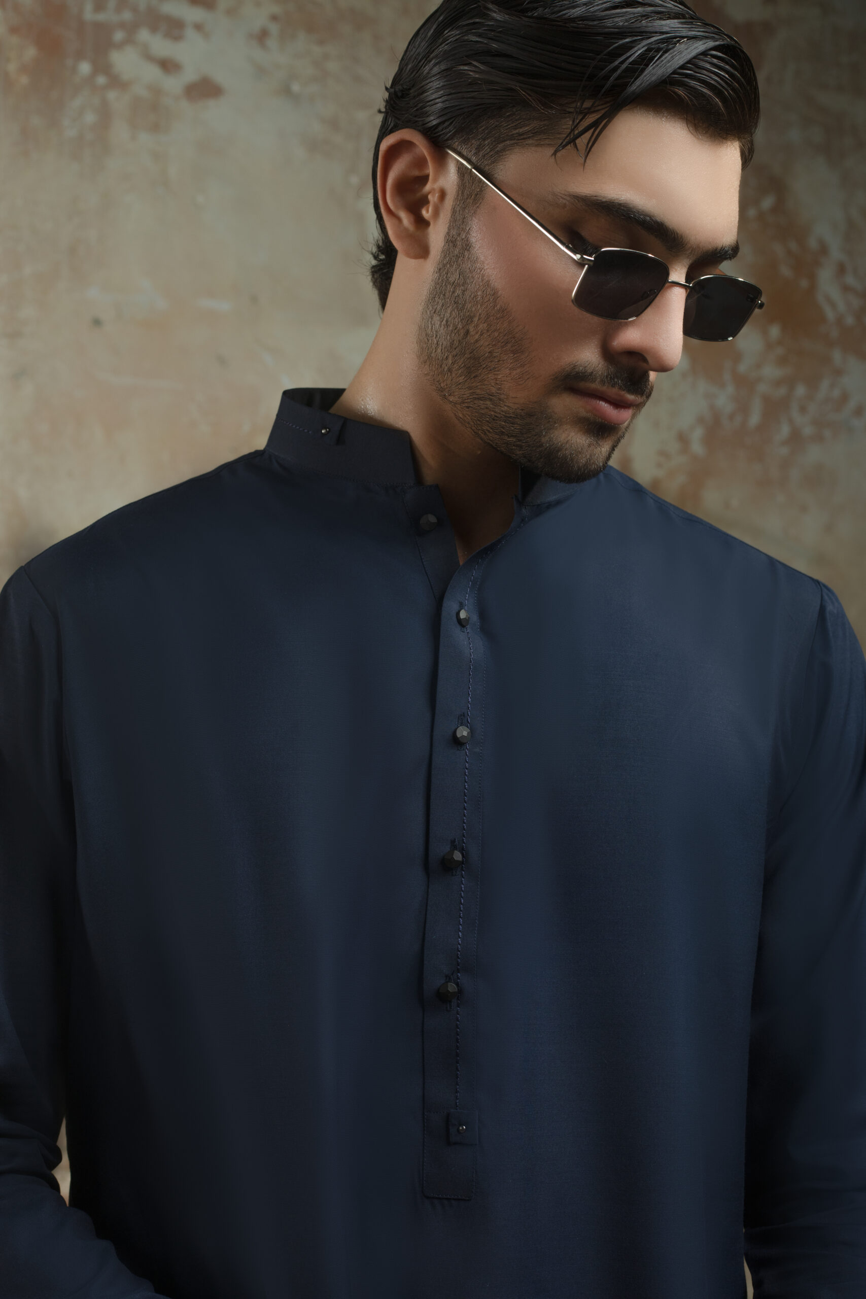 _F1A3002 NAVY BLUE MENS KURTA PYJAMA SET by Naushemian by Nauman Arfeen. Model wearing Mens Designer Traditional Wear with Band Collar Kurta for Formal Wedding Attire and Eid Outfit.