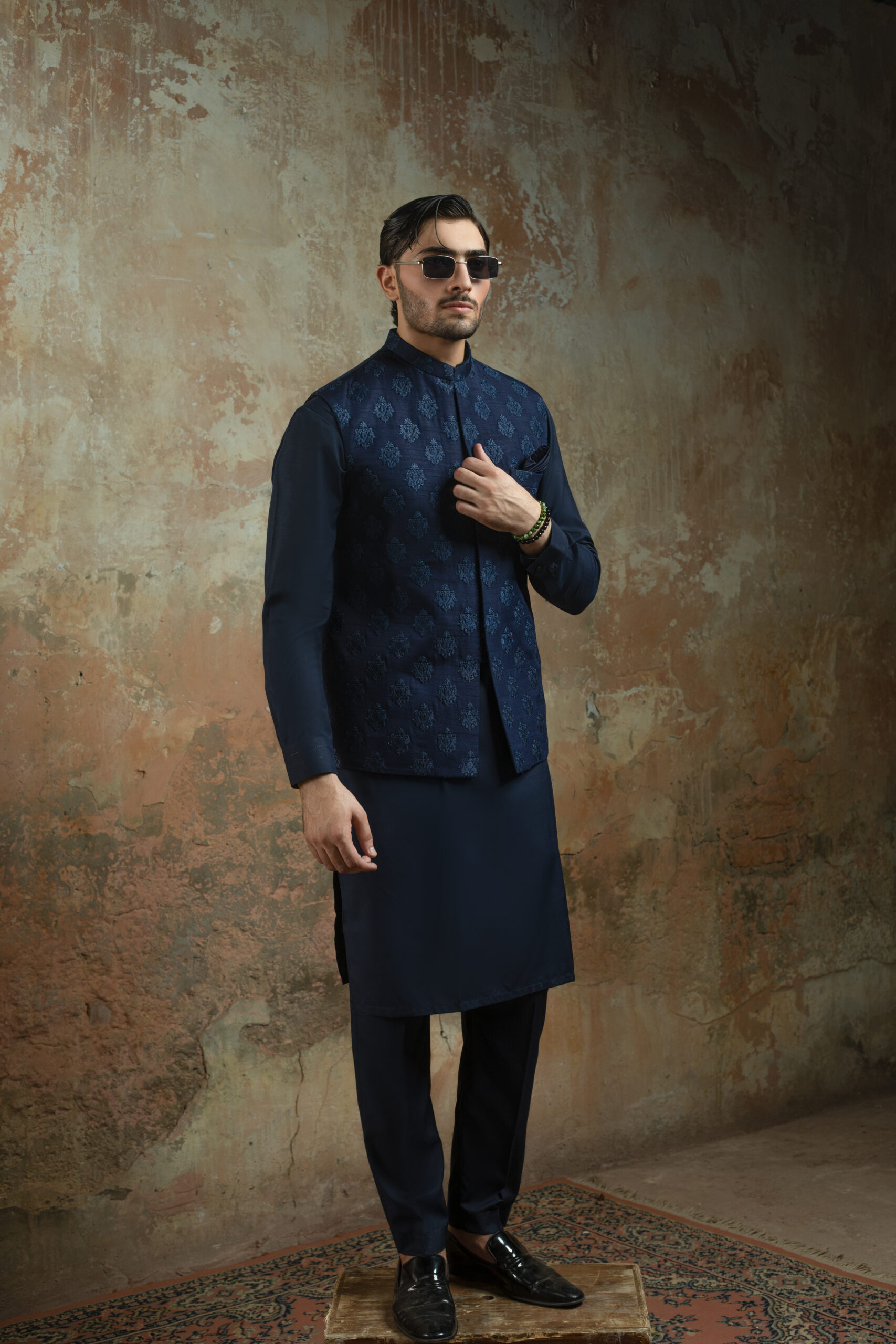 _F1A3011 Luxe Blue Raw Silk Waistcoat by Naushemian by Nauman Arfeen. Model wearing formal Designer Raw Silk Nehru Vest with Thread Motifs