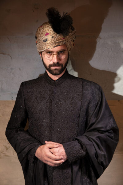 Designer black sherwani with matching embroidered shawl and black inner suit