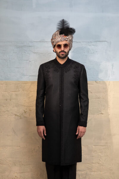 Designer black sherwani with embellished detailing and matching inner suit
