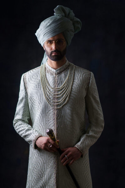 Luxury light green wedding sherwani for groom with pearl embroidery, thread handwork, and designer tailoring by Nauman Arfeen – perfect for South Asian weddings.