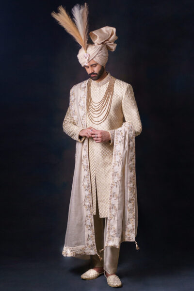 Luxury golden sherwani for groom by Nauman Arfeen – Amaaré Luxe NA-S200, handcrafted with intricate embroidery, perfect for weddings and formal occasions.