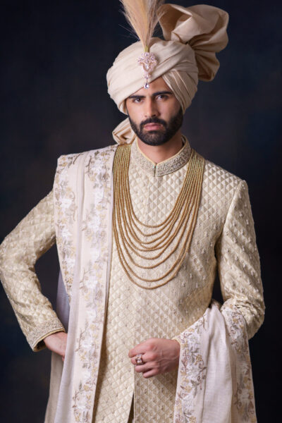 Luxury golden sherwani for groom by Nauman Arfeen – Amaaré Luxe NA-S200, handcrafted with intricate embroidery, perfect for weddings and formal occasions.
