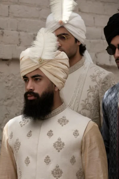 luxurious off-white waistcoat, featuring intricate motifs on the front and back