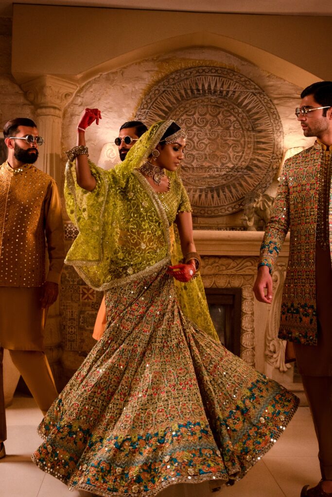 golden lehenga bride wearing beautiful golden lehenga on her mehendi by nauman arfeen - bridal dress