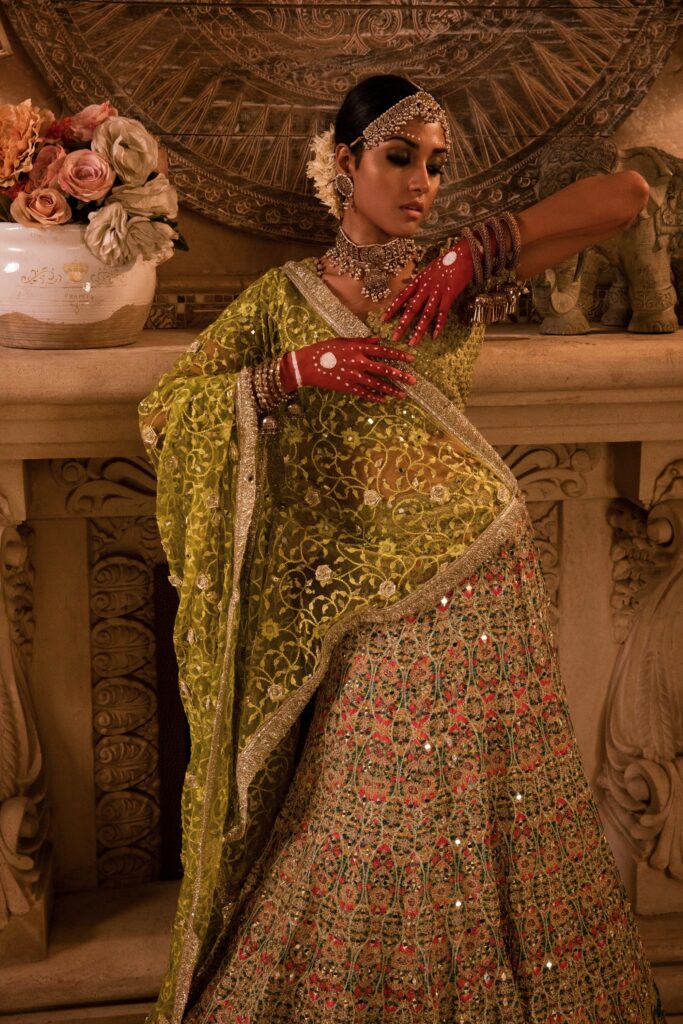golden lehenga bride wearing beautiful golden lehenga on her mehendi by nauman arfeen - bridal dress