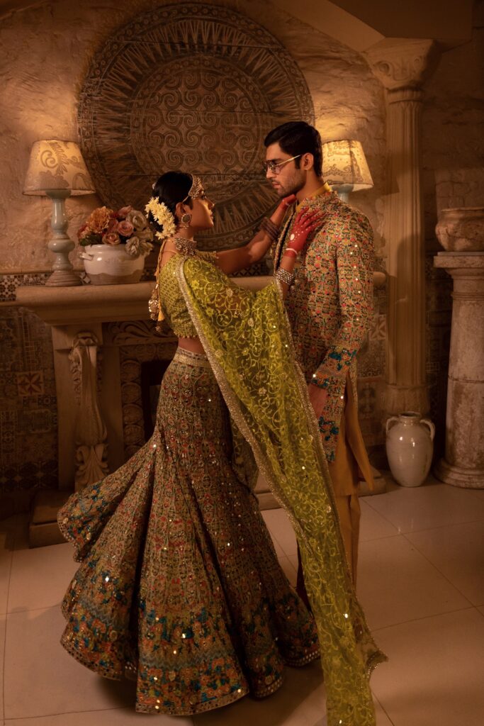 golden lehenga bride wearing beautiful golden lehenga on her mehendi by nauman arfeen - bridal dress - bride and groom
