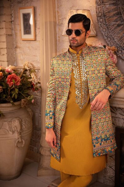 man wearing short open-front sherwani for groom of Naushemian by Nauman Arfeen