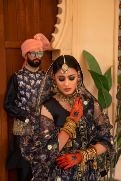 Black Embroidered Lehenga with Gold Accents and Opulent Dupatta showing Enchanting Elegance