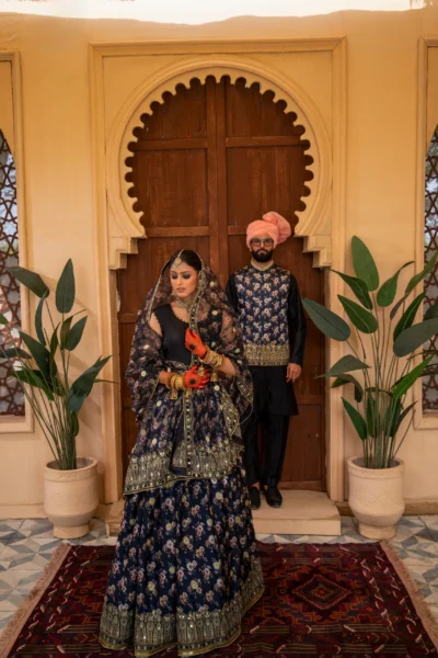 Black Embroidered Lehenga with Gold Accents and Opulent Dupatta showing Enchanting Elegance