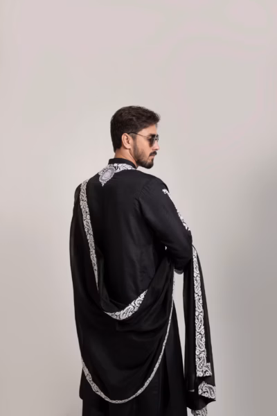 exotic black kurta, featuring white neck embroidery wedding wear for groom by nauman arfeen