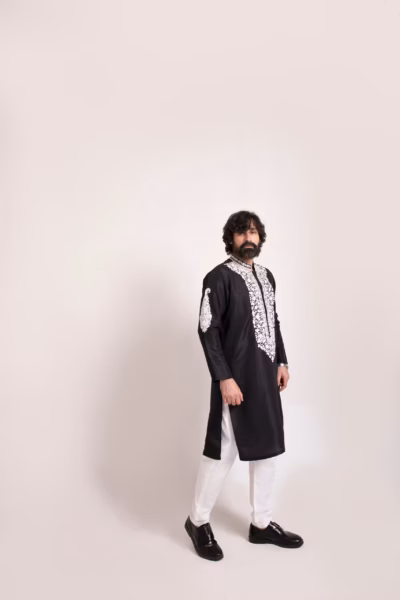 exotic black kurta, featuring white neck embroidery wedding wear for groom by nauman arfeen