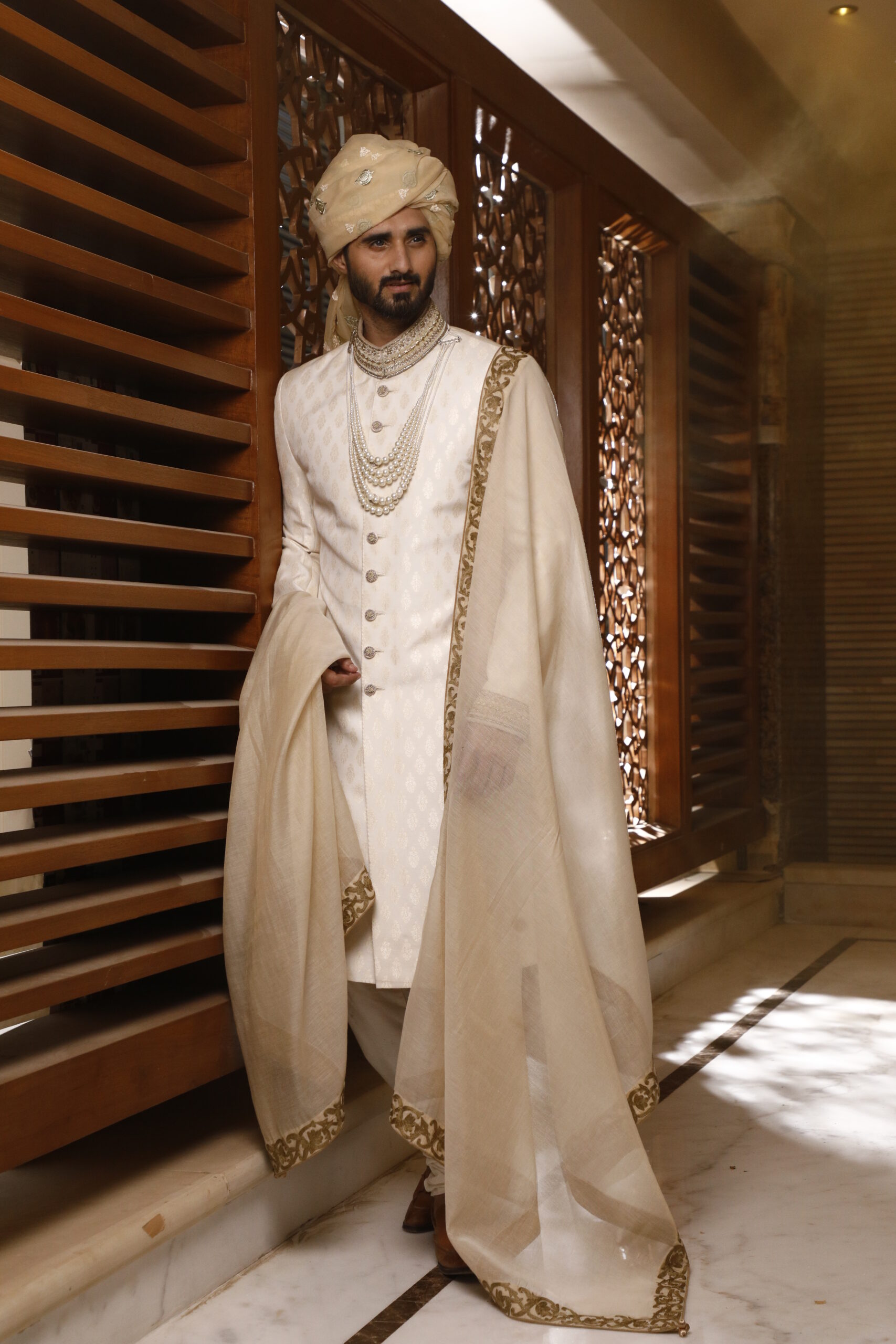 _J9A9877 vory Off-White Sherwani, with its matching turban, inner suit, and shawl