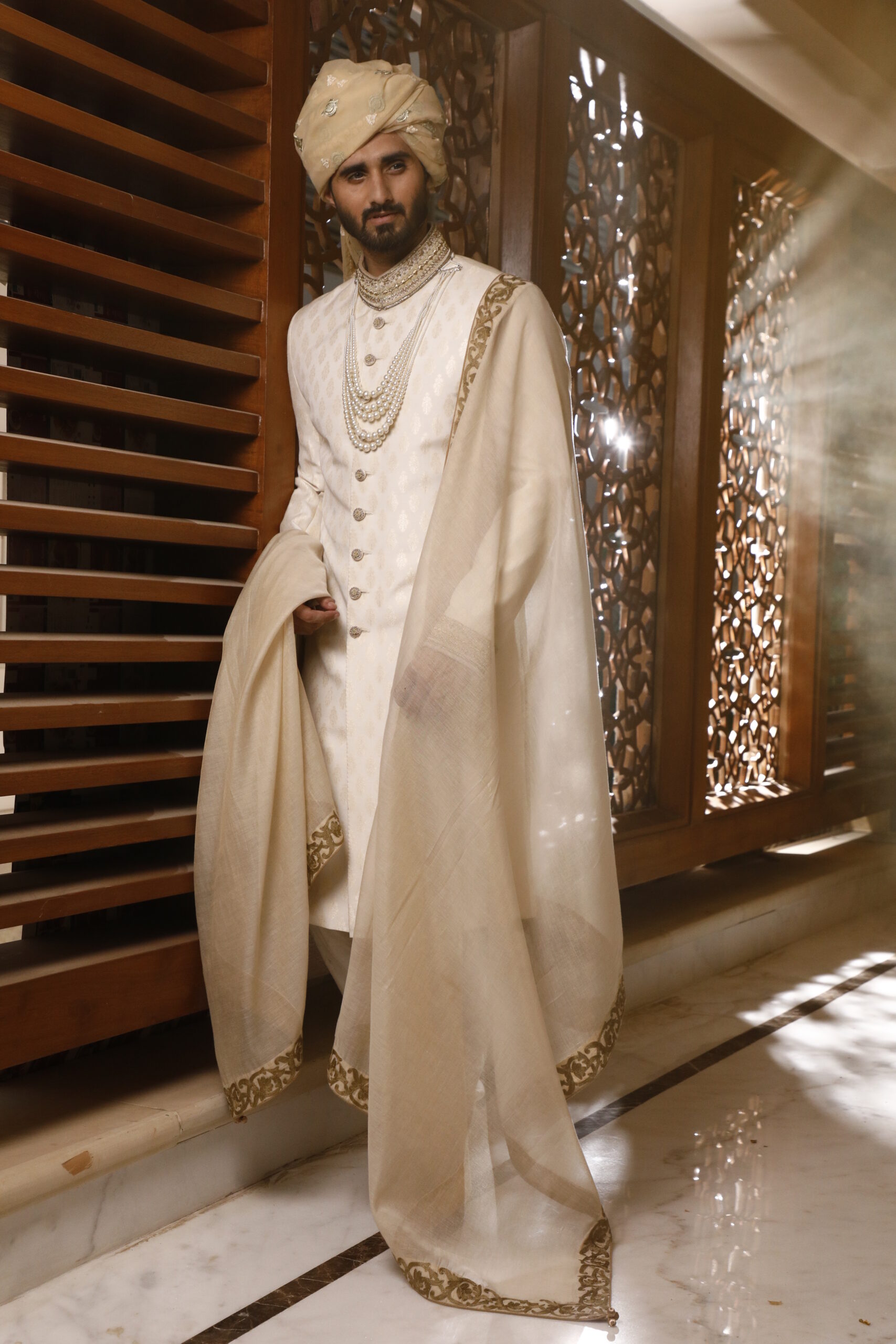 _J9A9880 vory Off-White Sherwani, with its matching turban, inner suit, and shawl