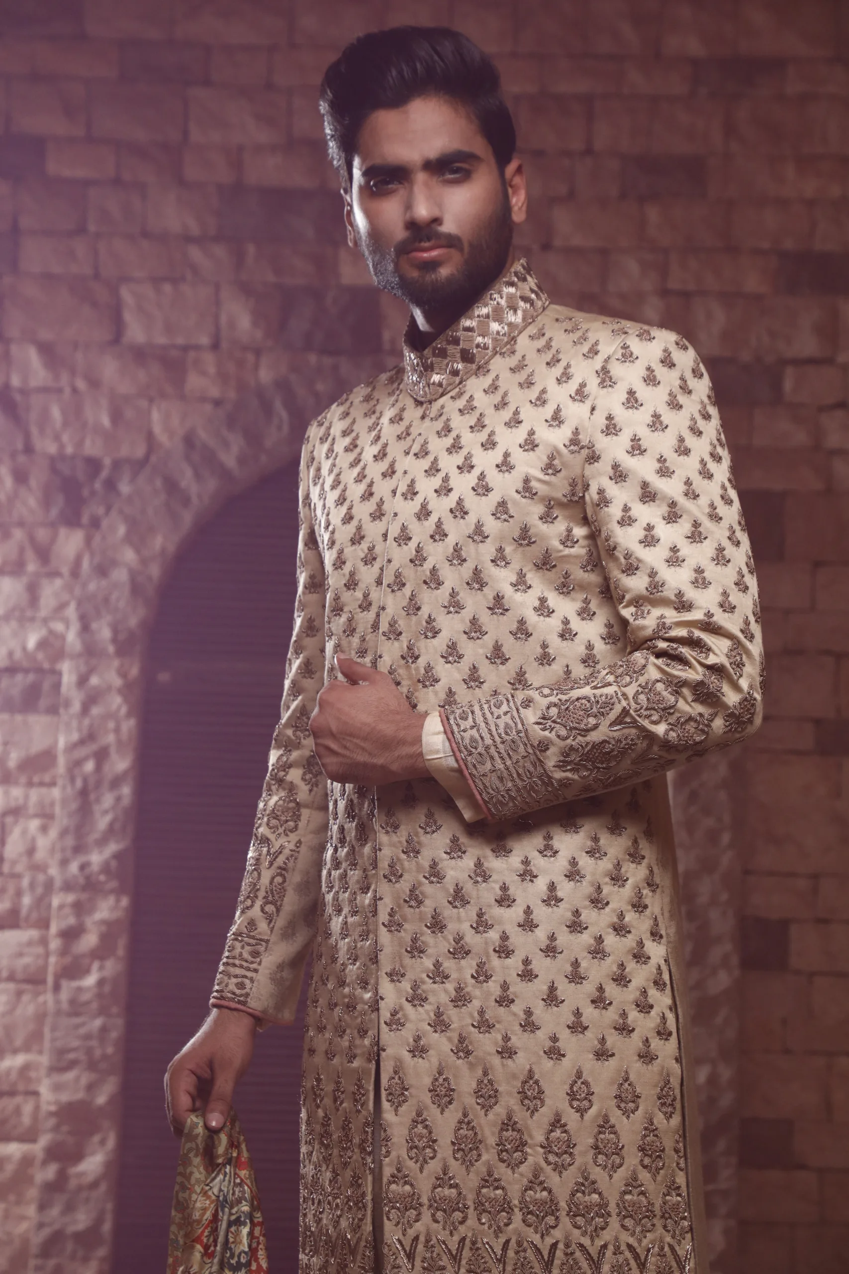 White sherwani_J9A9929 gold sherwani - Sherwani for Groom - Sherwani for Men With Motif Embroidered Sherwani the groom is wearing: โ Plain Inner Kurta in cotton silk โ Bottom Chooridaar Pyjamas in cotton silk โ Footwear Mocassin โ Shawl Abstarct Print
